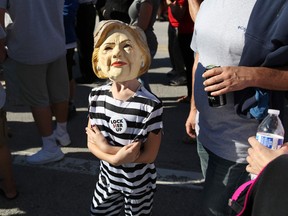 A young suupporter of Republican presidential nominee Donald Trump waits in line for a campaign event in Tampa, Florida.