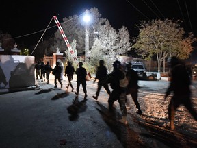 Pakistani army soldiers arrive at the Balochistan Police Training College in Quetta on October 24, 2016, after militants attacked the police academy