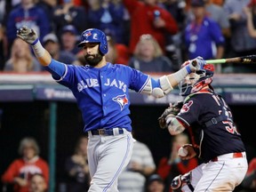 Jose Bautista strikes out against Cleveland in the ninth inning of Game Two of the ALCS on Oct. 15.