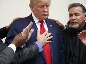 Pastors from the Las Vegas area pray with Republican presidential candidate Donald Trump during a visit to the International Church of Las Vegas, and International Christian Academy, Wednesday, Oct. 5, 2016, in Las Vegas.