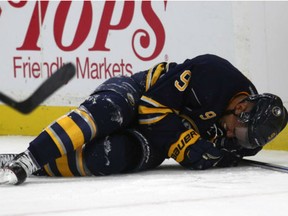 Sabres left winger Evander Kane lies on the ice after a collision with the boards during the second period of an game against the Montreal Canadiens, Thursday, in Buffalo.