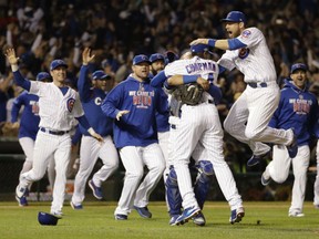 Cubs players celebrate after Game 6 of the National League Championship Series against the Los Angeles Dodgers on Saturday night in Chicago. The Cubs won 5-0 to advance to the World Series against the Cleveland Indians.