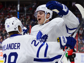 Toronto Maple Leafs centre Auston Matthews celebrates a first-period goal with teammate William Nylander from his NHL debut on Wednesday.