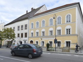 FILE - This Sept. 27, 2012 file picture shows an exterior view of Adolf Hitler's birth house, front, in Braunau am Inn, Austria. Austria's government said on Monday, Oct. 17, 2016 that it plans to tear down the house where Hitler was born and replace it with a new building. (AP Photo / Kerstin Joensson, File)