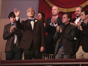 Bill Murray acknowledges applause after winning the Mark Twain Prize for American Humor, an award he tried to avoid receving.