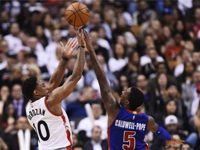 Raptors guard DeMar DeRozan shoots over the Detroit Pistons' Kentavious Caldwell-Pope during second half NBA action in Toronto on Wednesday night.