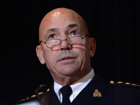 RCMP commissioner Bob Paulson speaks during a news conference in in Ottawa on Thursday, Oct. 6, 2016. Paulson has apologized to hundreds of current and former female officers and employees for alleged incidents of bullying, discrimination and harassment.