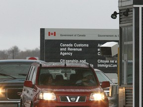 Vehicles wait at the Canada-U.S. border crossing in this file photo