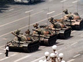 In this June 5, 1989 file photo, a Chinese man stands alone to block a line of tanks heading east on Beijing's Cangan Blvd.