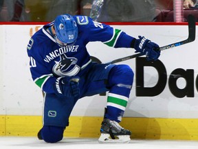 Brandon Sutter of the Vancouver Canucks celebrates his game-winning goal in overtime Sunday as the Canucks fight back from a three-goal deficit to defeat the Carolina Hurricanes 4-3 in NHL action in Vancouver.