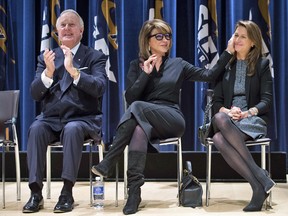 Former prime minister Brian Mulroney applauds as his wife Mila, centre, affectionately acknowledges their daughter Caroline Mulroney Lapham during the announcement of the $60 million Brian Mulroney Institute of Government and Mulroney Hall at St. Francis Xavier University in Antigonish, N.S. on Wednesday, October 26, 2016.