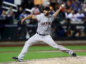 San Francisco Giants' Madison Bumgarner fires a pitch against the New York Mets during Wednesday's National League wild-card game in New York. Bumgarner pitched a complete-game shutout as the Giants won 3-0 to advance to the NLDS against the Chicago Cubs beginning Friday.