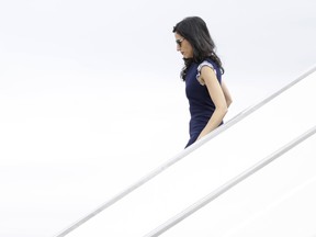 Huma Abedin, a senior aide for Democratic presidential candidate Hillary Clinton, walks off of Clinton's campaign plane at Raleigh-Durham International Airport in Morrisville, N.C., Tuesday, Sept. 27, 2016.