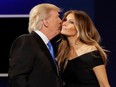 Republican presidential nominee Donald Trump kisses his wife Melania Trump after the presidential debate in Hempstead, N.Y., on Sept. 26.