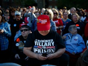 Supporters of Republican presidential candidate Donald Trump wait for his arrival to a campaign rally at Regent University, Saturday, Oct. 22, 2016, in Virginia Beach, Va.