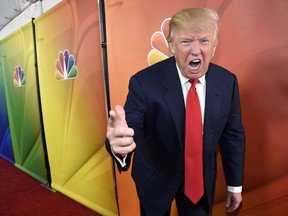 In this Jan. 16, 2015 file photo, Donald Trump, host of the reality television series 'The Celebrity Apprentice,' poses for photographers