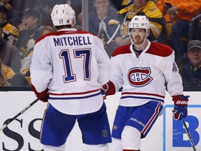 Montreal Canadiens' Paul Byron is congratulated by Torrey Mitchell after scoring a shorthanded goal during the third period against the Bruins in their game in Boston on Saturday night.