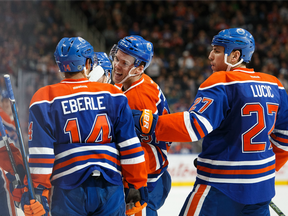 Edmonton celebrates a goal by Connor McDavid (centre) on Oct. 8.