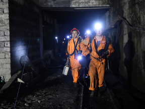 Rescuers work at Jinshangou Coal Mine in Chongqing, southwest China on Monday, Oct. 31, 2016 after a gas explosion killed 13 and left 20 others trapped.
