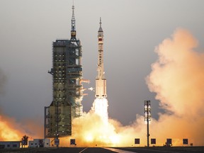 China's Shenzhou 11 spaceship onboard a Long March-2F carrier rocket takes off from the Jiuquan Satellite Launch Center in northwest China's Gansu province on Monday Oct. 17, 2016.