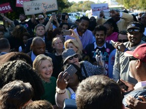 Hillary Clinton meets with voters during an impromptu stop at an early voting center in Raleigh, N.C. Saturday.