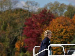 Democratic presidential nominee  Hillary Clinton boards her campaign plane at Westchester County Airport on October 24, 2016 in White Plains, New York.