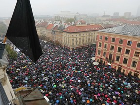 Thousands took part in a “Black Monday” strike to protest a proposed total ban on abortion, in  Warsaw on Oct. 3.
