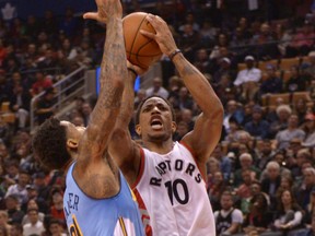 Toronto Raptors' DeMar DeRozan, right, goes up for a shot against defender Wilson Chandler of the Denver Nuggets during NBA action Monday night at the Air Canada Centre. DeRozan had 33 points as the Raptors posted a 105-102 victory. It was DeRozan's third straight game with 30 or more points, a franchise record.