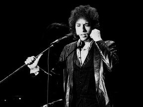 This file photo taken on on July 4, 1978 shows r Bob Dylan performing in Paris. Dylan won the Nobel Literature Prize Thursday, the first songwriter to win the prestigious award and an announcement that surprised prize watchers.