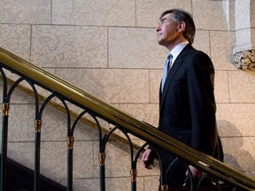 Jim Prentice leaves the foyer of the House of Commons following question period in Ottawa on Monday, April 20, 2009.