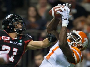 B.C. Lions' Terrell Sinkfield Jr., right, makes a reception in the end zone for a touchdown as the Ottawa Redblacks' Mitchell White defends during the second half of their CFL game in Vancouver on Saturday night.