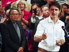 Prime Minister Justin Trudeau, right, attends a campaign event for Liberal party byelection candidate Stan Sakamoto, left, in Medicine Hat, Alta., Thursday, Oct. 13, 2016. Sakamoto would lose but the Liberals had one of their best showings ever in a southern Alberta riding.