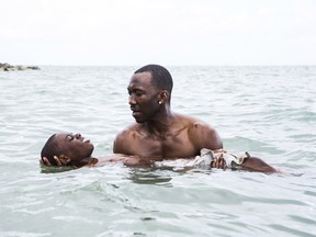 Alex Hibbert, left, and Mahershala Ali in a scene from the film, Moonlight.