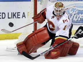 Calgary Flames goalie Brian Elliott keeps his eye on a loose puck during the second period of their game against the Blues on Tuesday night in St. Louis.