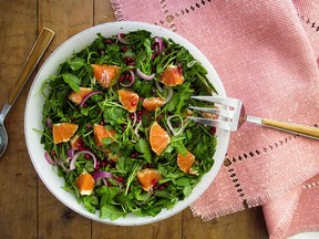 Arugula, red onion, orange and pomegranate seed salad with lemon vinaigrette.