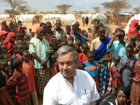 In a 2011 photo, then UN refugee chief Antonio Guterres is surrounded by Somali refugees on the outskirts of Dagahaley Camp in Kenya.