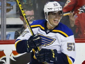 St. Louis Blues' David Perron celebrates his hat-trick during third period NHL action against the Flames in Calgary on Saturday night.