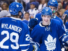 Toronto's Mitch Marner (right) celebrates with William Nylander after the Maple Leafs' 4-1 win over Boston on Oct. 15.