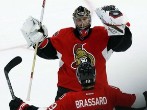 Senators goalie Craig Anderson celebrates with teammate Derick Brassard after beating the Montreal Canadiens 4-3 in a shootout in Ottawa on Oct. 15.