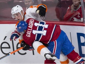 Philadelphia Flyers' Ivan Provorov is taken out by Montreal Canadiens' Brendan Gallagher during game in Montreal on Monday night.