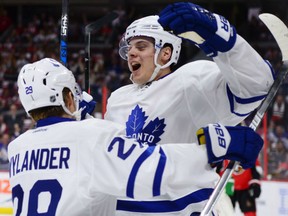 Toronto Maple Leafs rookie Auston Matthews (right) celebrates one of his four goals against the Ottawa Senators on Oct. 12.