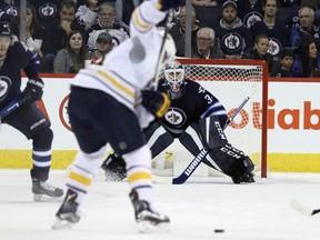 Buffalo Sabres forward Kyle Okposo winds up to shoot on Winnipeg Jets goaltender Michael Hutchinson on Oct. 30.