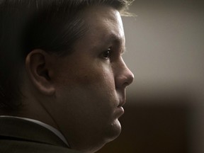 Justin Ross Harris listens to jury selection during his trial at the Glynn County Courthouse in Brunswick, Ga., on Monday, Oct. 3. The court heard he exchanged raunchy text messages with a teen girl weeks before he allegedly left his son to die in a hot car.