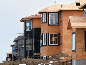 A row of houses is under construction in Royal Oak, Calgary.