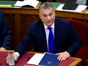 Hungarian Prime Minister Viktor Orban gives a speech at the parliament in Budapest on October 3, 2016