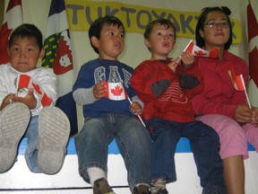 Children in Tuktoyaktuk, Northwest Territories welcome former prime minister Stephen Harper during his visit in Augsut, 2010.