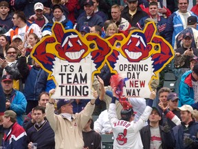 Cleveland Indians fans hold up Chief Wahoo signs in 2002.