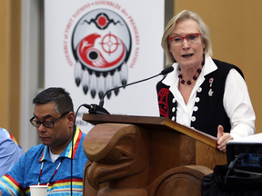 Carolyn Bennett, Minister of Indigenous and Northern Affairs, speaks at the Assembly of First Nations' annual general meeting in Victoria, B.C., while Regional Chief Shane Gottfriedson listens, Oct. 24, 2016.