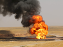Flames rise from a well at Bai Hassan oil field, the largest in Iraqi's oil-rich Kirkuk province, after an improvised explosive device (IED) went off.