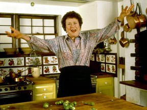 Chef Julia Child in a hail of brussel sprouts in her kitchen.